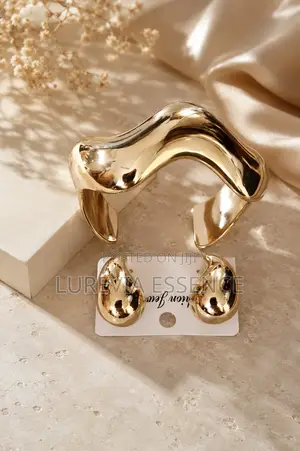 A Chunky Gold Cuff and Matching Earring