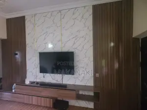 Custom Wall-Mounted TV Console Unit With Marble Finish