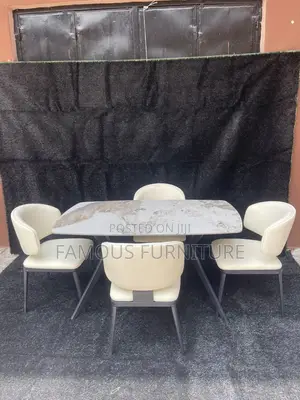 This Is a 4-Seater Dining Set Featuring a Marble-Patterned Table
