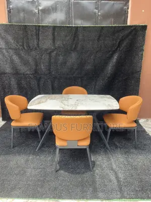 This Is a 4-Seater Dining Set Featuring a Marble-Patterned Table