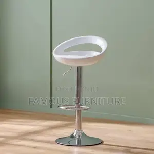 This Is a Modern White Plastic Adjustable-Height Swivel Bar Stool