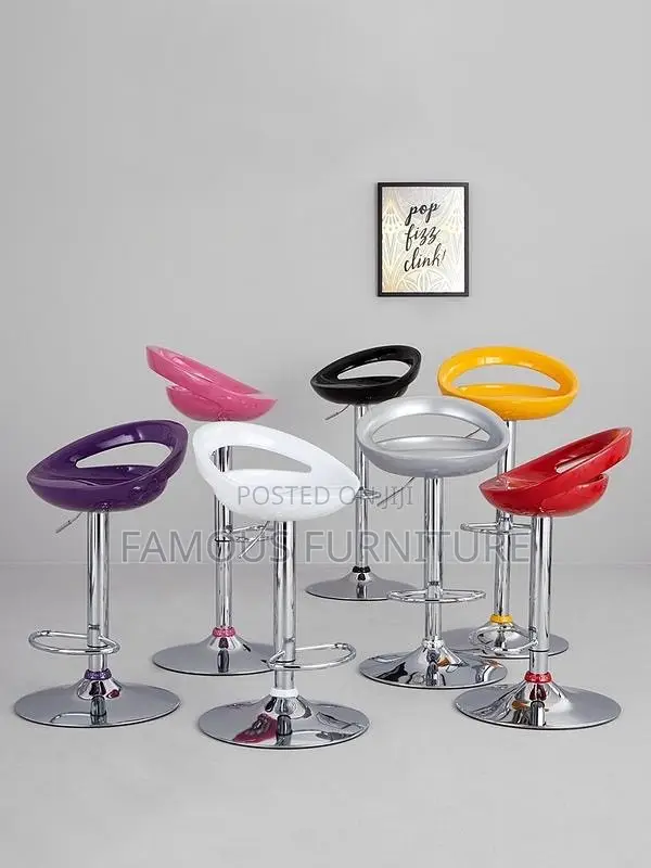 This Is a Modern White Plastic Adjustable-Height Swivel Bar Stool