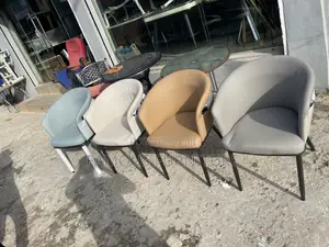 This Is a Modern Camel-Colored Accent Dining Chair Featuring a Curved