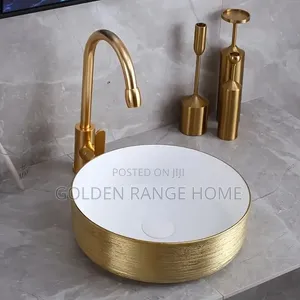 Gold and White Round Countertop Basin