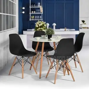 Mid-Century Modern Round Dining Set Featuring a Smooth White Table