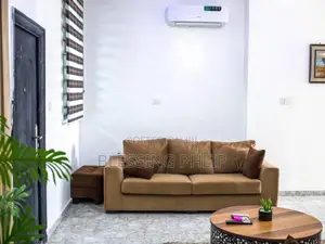 4 Seater Brown Sofa and a Side Small Table