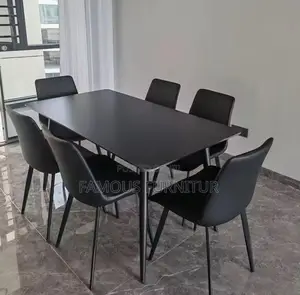 This Is a Modern Six-Seater Dining Set Featuring a Smooth White Marble