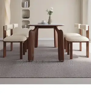 The Image Shows a Modern Minimalist Dining Set With a White Marble-Top