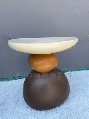 This Is a Modern Resin Pebble Side Stool Featuring a Unique Stacked