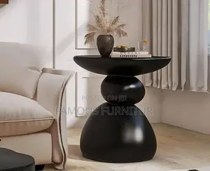 This Is a Modern Resin Pebble Side Stool Featuring a Unique Stacked