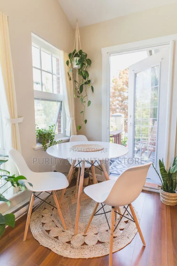 Round Dinner Table and a Plastic Chair