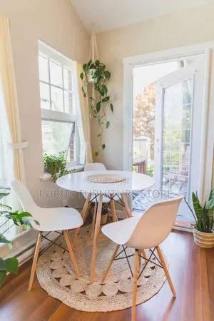 Round Dinner Table and a Plastic Chair