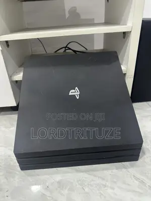PS4 PRO With 2 Gamepads and 15 Games Installed