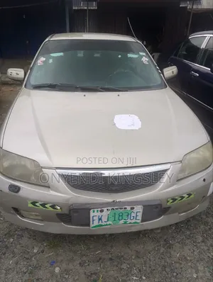 Mazda 323 2000 Gold