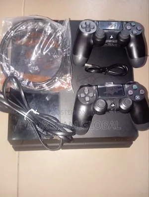 UK Used Sony PS4 With Games Installed and 2 Pads With Power USB Cord