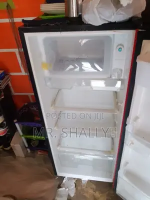 Neatly Used Red Hisense Fridge With Water Dispenser.