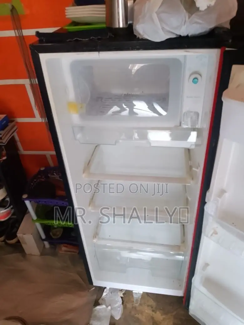Neatly Used Red Hisense Fridge With Water Dispenser.
