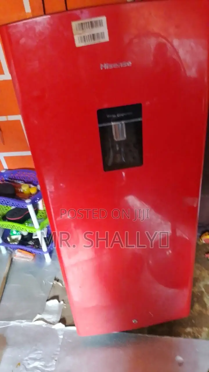 Neatly Used Red Hisense Fridge With Water Dispenser.