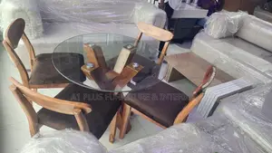A Round Dining Set With Warm Brown Seating