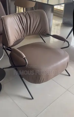 This Is a Modern Leather Accent Lounge Chair Featuring Distinctive