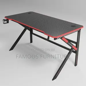 The Image Shows a Black and Red Carbon Fiber Z-Shaped Gaming Desk