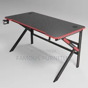 The Image Shows a Black and Red Carbon Fiber Z-Shaped Gaming Desk