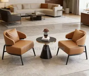 Tan Leather Accent Chair With Curved Armrests and Black Metal Legs,