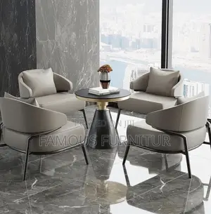 Tan Leather Accent Chair With Curved Armrests and Black Metal Legs,