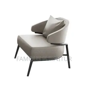 Tan Leather Accent Chair With Curved Armrests and Black Metal Legs,