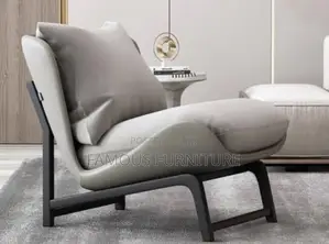 Modern Accent Lounge Chair With a Tan Brown Curved