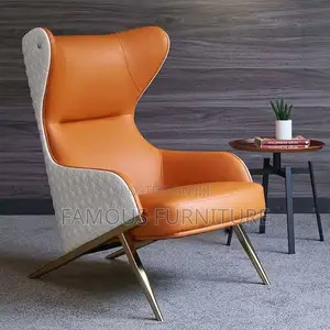 Modern High-Back Wingback Accent Chair Featuring a Vibrant Orange