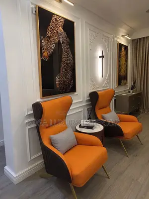 Brand New Orange Wingback Armchairs