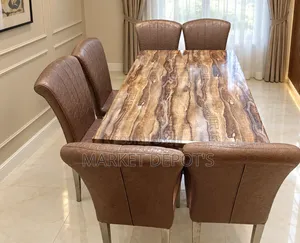 Foreign Marble Top Dining Table Equipped With Solid Leather Chairs.