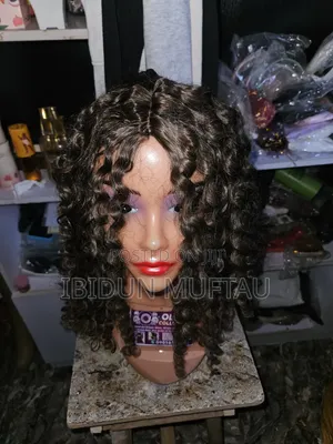 Synthetic Curls Wig.