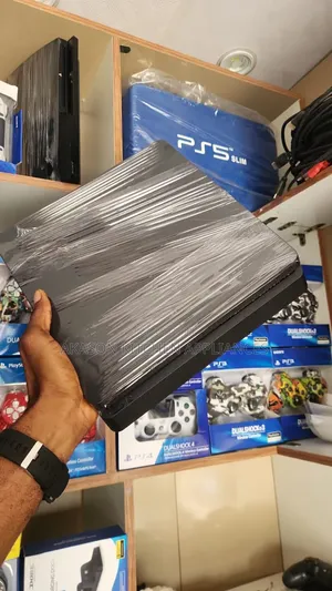 PS4 Slim With 2 Pads and Games