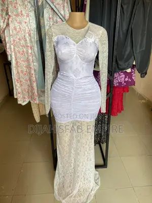Fitted White Mini Dress With a Sheer Overlay.