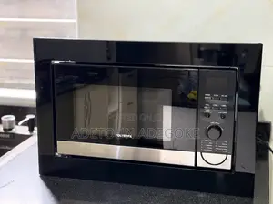 A Neatly Used Built in Microwave