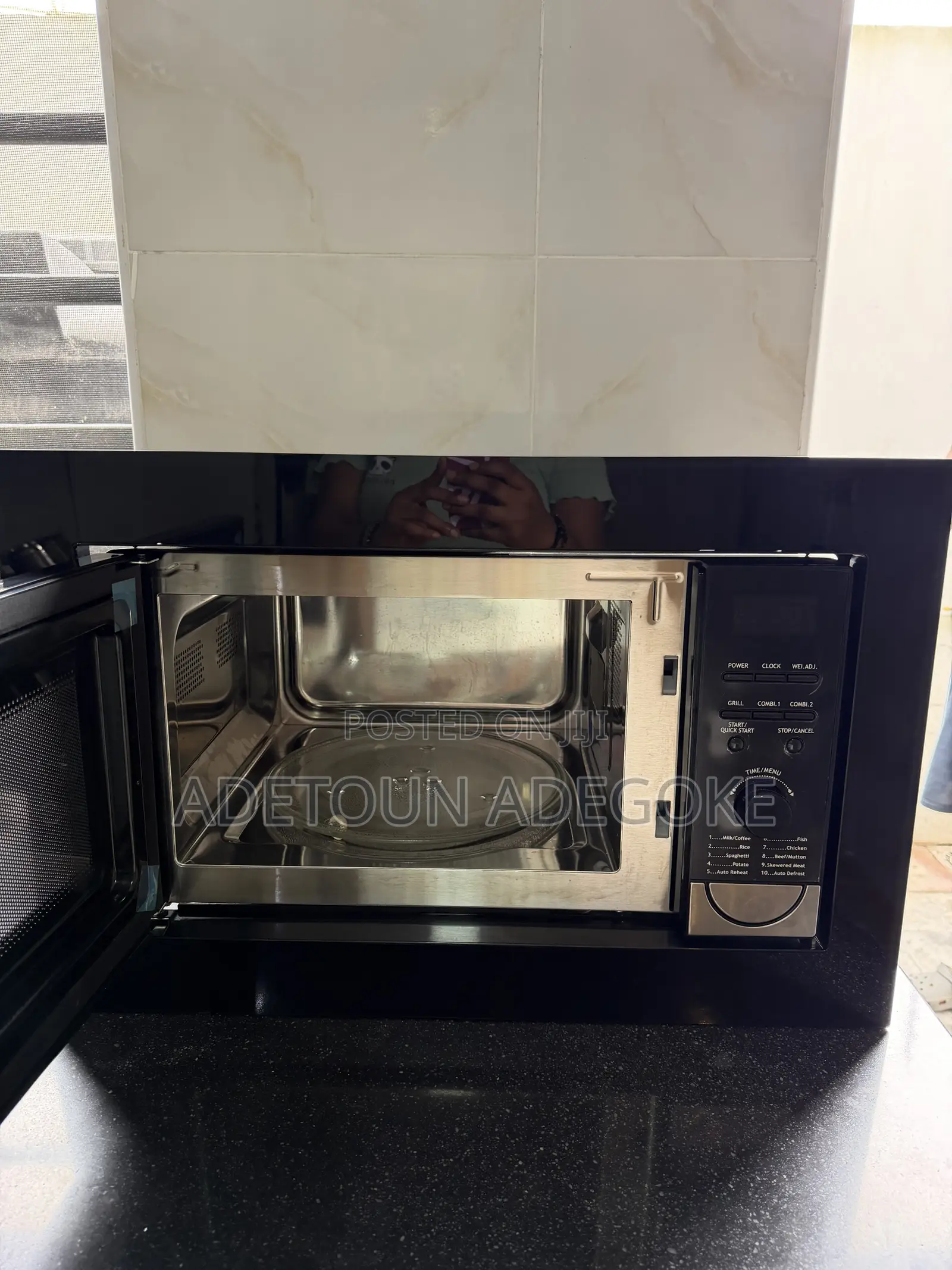 A Neatly Used Built in Microwave