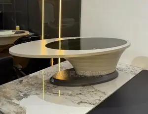 Modern Minimalist Oval Coffee Table Featuring a Dark Glass Center