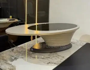 Modern Minimalist Oval Coffee Table Featuring a Dark Glass Center