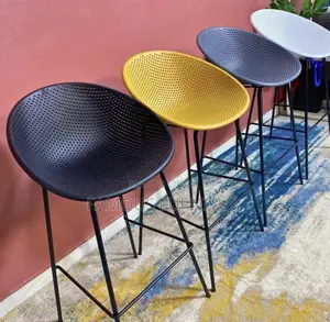 Modern Bar Stools Featuring Curved, Perforated Shell Seats Supported