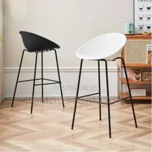 Modern Bar Stools Featuring Curved, Perforated Shell Seats Supported