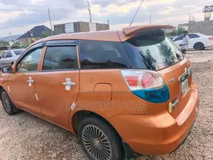 Toyota Matrix Hatchback AWD (1.8L 4cyl 4A) 2006 Orange