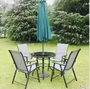 Four Outdoor Foldable Chairs With Umbrella and Center Tables