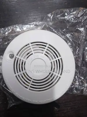 White Battery-Operated Photoelectric Smoke Detector and Alarm Labeled