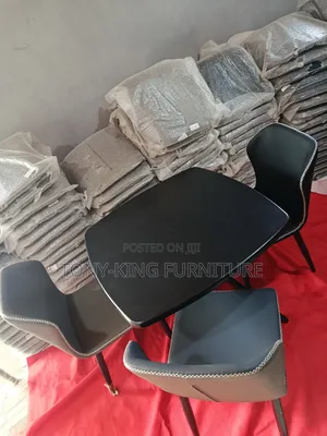 Modern 4-Seater Dining Set Featuring a Sleek Black Table Paired