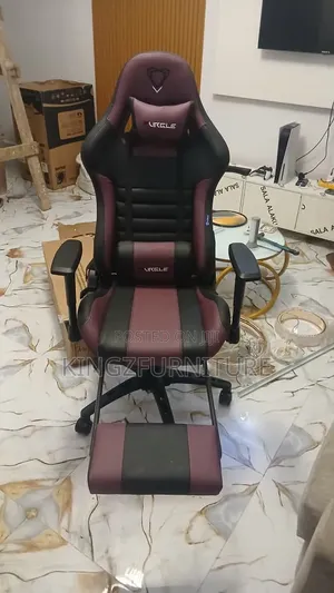 Purple/Black Ergonomic Gaming Chair Featuring a Built-in Footrest