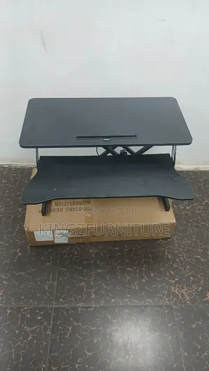 A 32-Inch Sit-Stand Desk Converter (Height-Adjustable Desktop Riser).