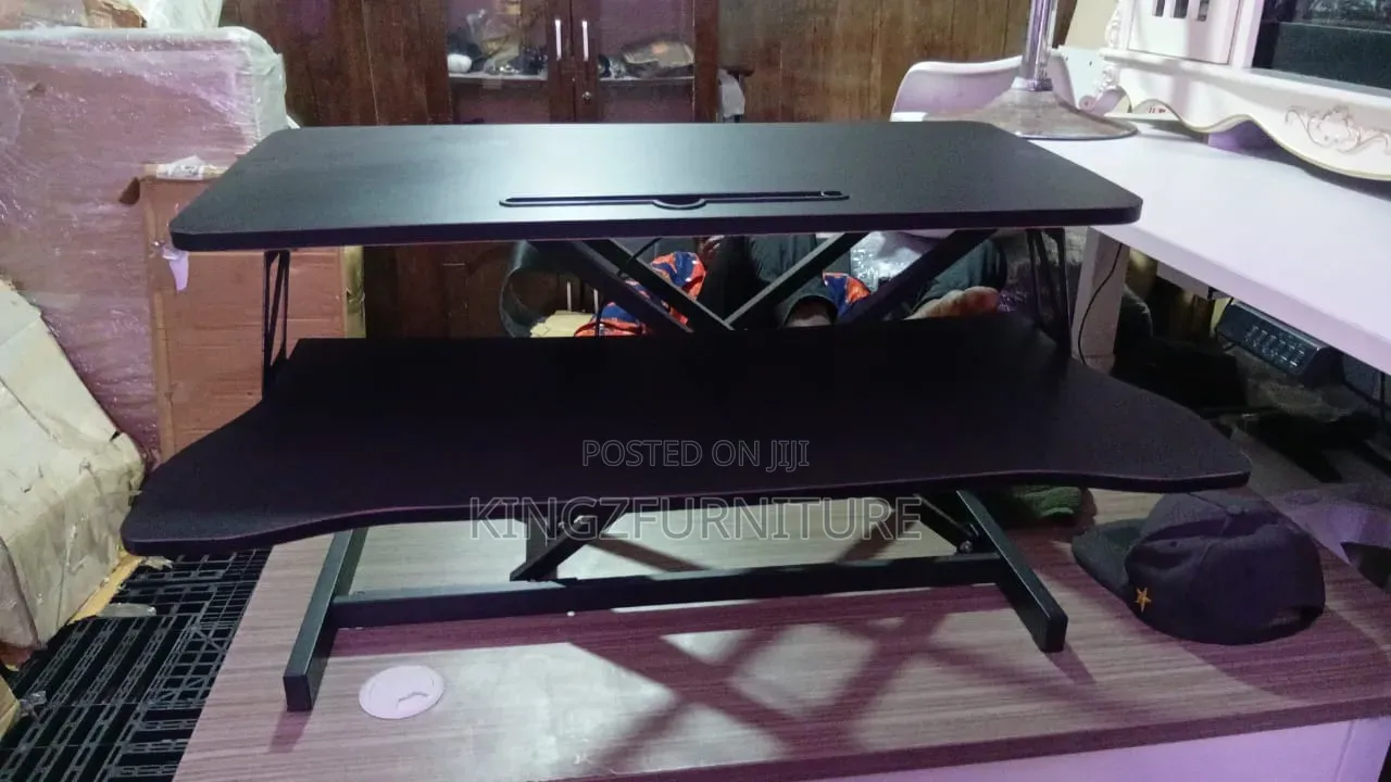 A 32-Inch Sit-Stand Desk Converter (Height-Adjustable Desktop Riser).