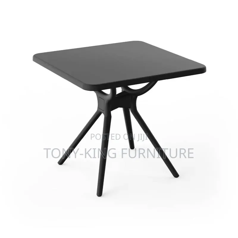 Black Square Restaurant Table With Angled Legs and a Smooth Top